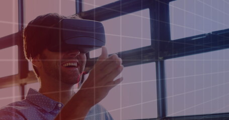 Image of financial data processing over businessman using vr headset