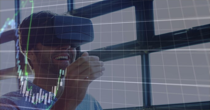 Image of financial data processing over businessman using vr headset - Powered by Adobe