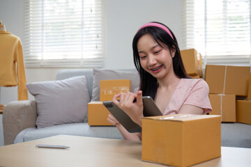 The owner sells things online online shopping Startup business, SME idea, young startup entrepreneur, small business owner, working from home. Packing and shipping situation