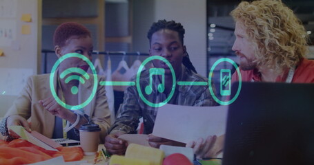 Image of network of connections over diverse colleagues discussing work in office