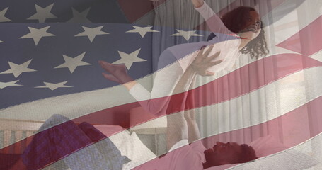 Image of flag of united states of america over african american father and daughter having fun