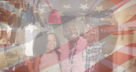 Fototapeta premium Image of flag of united states of america over african american father and daughter having fun