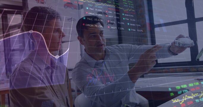 Image of stock market data processing over two diverse male engineers discussing over car model