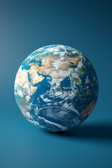 Fototapeta premium a close up of a blue earth with a shadow on a blue background