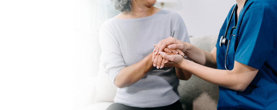  Young Caregiver doctor examine older patient use blood pressure gauge. woman therapist nurse at nursing home taking care of senior elderly woman sit on sofa.