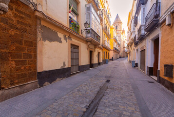 Old narrow traditional street in Cadiz at dawn. - 758003993