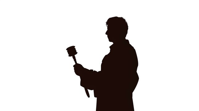 Silhouette of Man Holding Auction Hammer