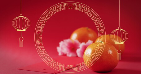 Image of chinese pattern and orange decoration on red background