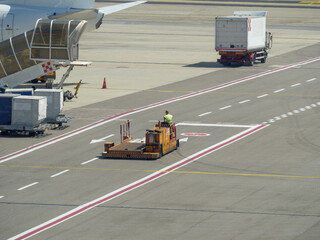 Motorized Moving Platform Transported by an Operator Near an Airport Runway