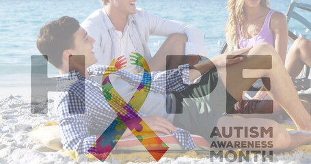 Image of colourful puzzle pieces and autism text over happy friends at summer beach party