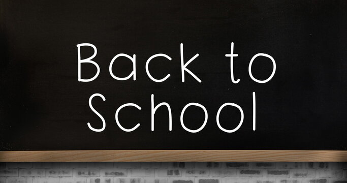Image of back to school text and schoolboy over blackboard