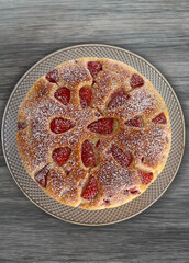 strawberry cheesecake on a grey background
