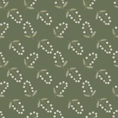 Seamless floral watercolor pattern with small flowers on a green background. Hand drawn wallpaper design.