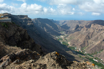 Obraz premium Mountains with a small village in the valley