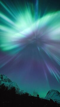 An aurora forming a spectacular and colorful flower above out heads as a substorm breaks out over northern Norway on March 3rd, 2024.