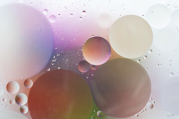 Abstract colorful backdrop with oil drops on water surface. Abstract background.