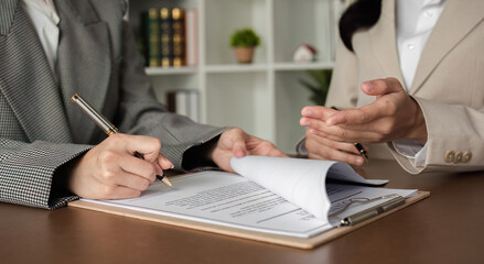 Lawyer and businesswomen discussing and introducing Providing legal advice regarding signing...