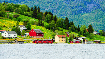 Mountains and Fiord over Norwegian Village in Olden, Innvikfjorden, Norway - obrazy, fototapety, plakaty