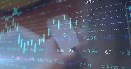 Image of financial data processing over woman using smartphone with blank screen