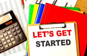 LET'S GET STARTED text written on paper clipboard with chart and calculator