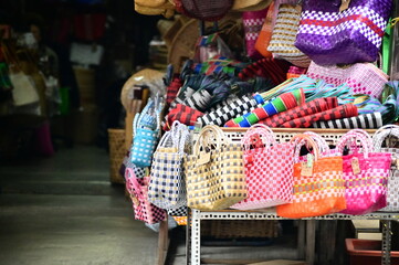 TW - 01.08.24: Gaojian Tongdian, a Dihua Street mainstay, sells wooden barrels, bamboo utensils, rattan and straw goods. The photo shows a close-up of their wares.