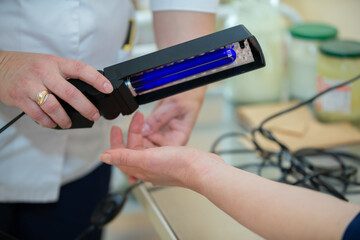 Treatment of psoriasis and skin diseases with blue light from an ultraviolet lamp.