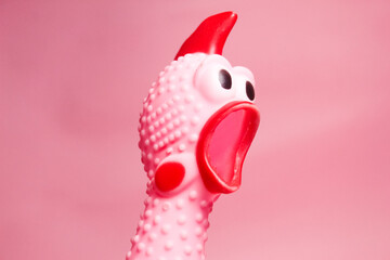 close up of a pink chicken toy