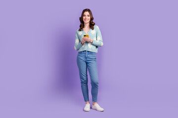 Full length photo of positive pretty woman wear print cardigan chatting instagram twitter telegram...