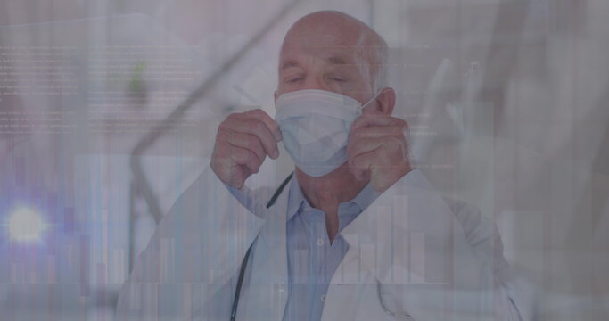 Image of data processing over caucasian male doctor with face mask