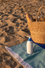 Sun screen cosmetic bottle on the beach. Summer vacation lifestyle concept