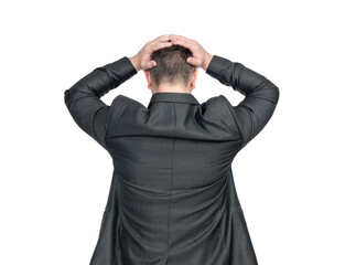 A depressed man in a dark suit stands holding his head with both hands, rear view. Isolated on a transparent background png