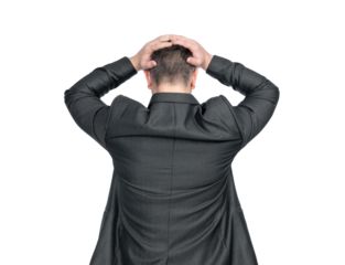 A depressed man in a dark suit stands holding his head with both hands, rear view. Isolated on a transparent background png