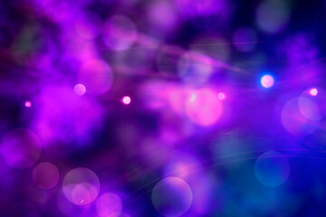 Purple bokeh spots from stage lighting. Festive bright background.