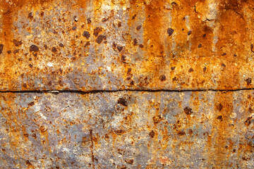 August, 2022- Rust and paint, texture from a fishing boat, on the coast in Dalmatia, Croatia, EU