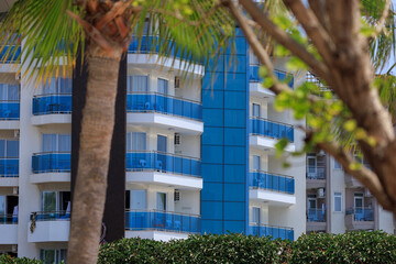 Southern cityscape, view of buildings and houses, palm trees and mountains, in public places in Turkey, sunny summer day in a resort town