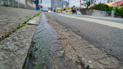 Water and garbage on the main street of this large city in the State of São Paulo - Brazil