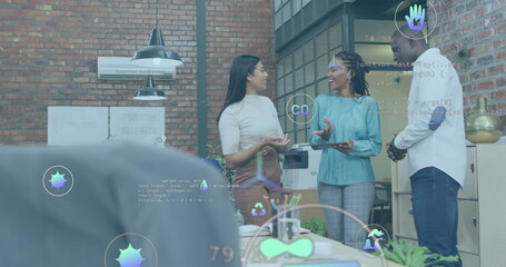 Image of multiple icons over diverse coworkers standing and discussing in office