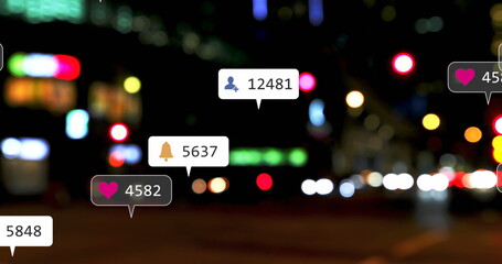 Image of social media icons and numbers over out of focus city lights
