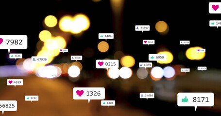 Image of social media icons and numbers over out of focus city lights