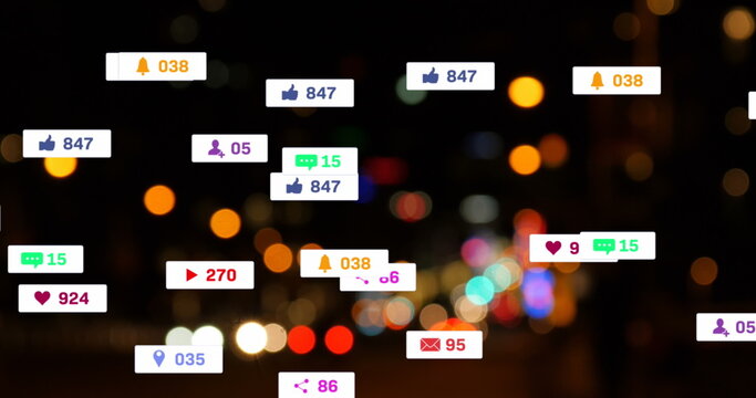 Fototapeta Image of social media icons and numbers over out of focus city lights