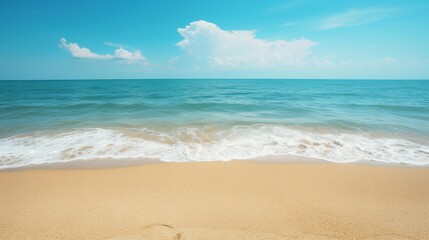 Fototapeta na wymiar Beautiful scene features empty sandy beach with sea background