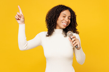 Little singer kid teen girl of African American ethnicity she wear white casual clothes sing song...