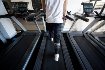 Electric treadmill with athlete's back