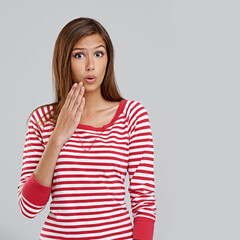 Hand, shock and portrait of woman with surprise for omg, wow or mockup isolated on gray background. Model, casual or lady for fashion, style and trendy with stripe shirt, top or outfit and expression