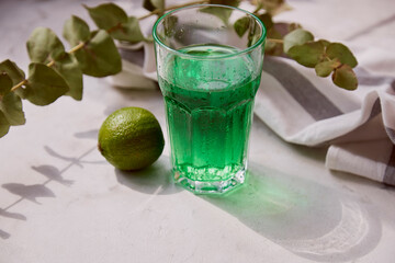 Fresh lime healthy tarragon detox sparkling, vitaminized drink. Green non alcoholic Mocktail for St. Patricks Day.