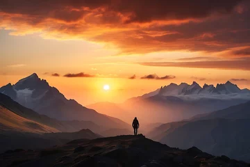  Hiker man standing on the top of a mountain and looking at the sunset. Man on top of the mountain © ASGraphics