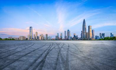 Asphalt road square and urban skyline with modern buildings at sunrise in Shenzhen