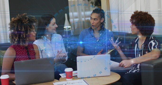 The image shows a group of business colleagues working together in an office