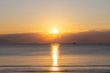Golden sunrise over calm sea waters - 758064923