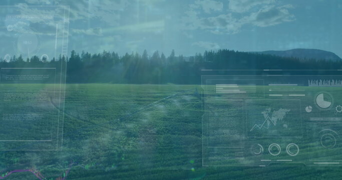 Image of multiple screens with data processing against aerial view of grassland